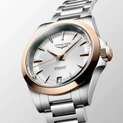 Longines Conquest 34mm L3.430.5.72.6 | Dame Dameure Med Lænke | Dameure I Bicolor