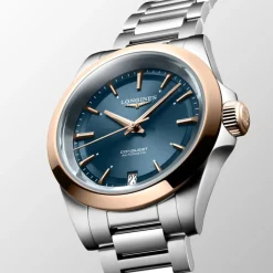 Longines Conquest 34mm L3.430.5.92.6 | Dame Dameure Med Lænke | Dameure I Bicolor