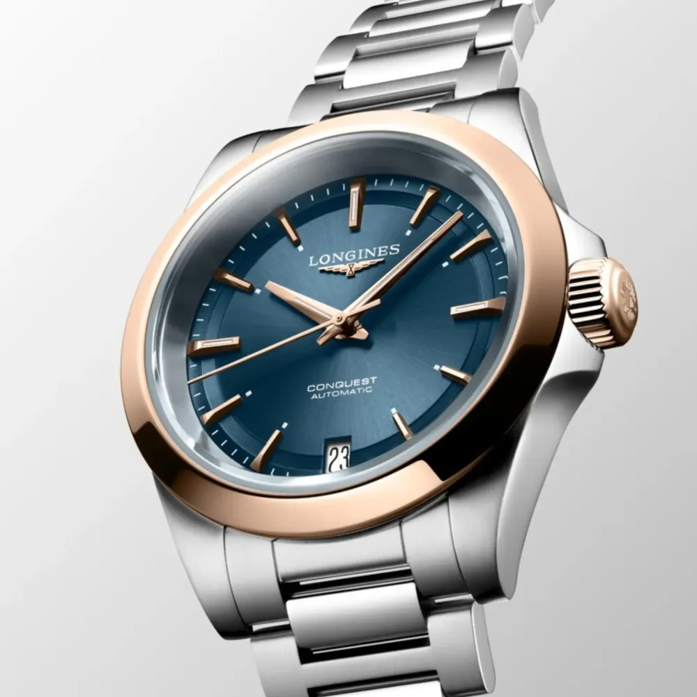 Longines Conquest 34mm L3.430.5.92.6 | Dame Dameure Med Lænke | Dameure I Bicolor